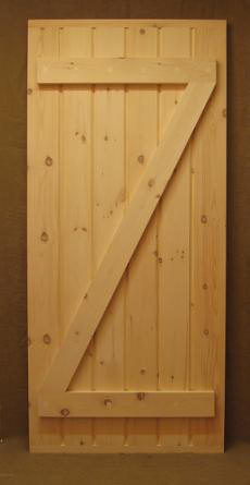 wood exterior stockade door with crossbuck