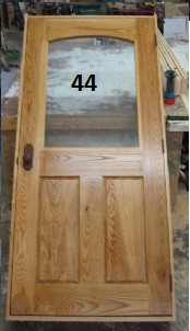 Exterior ash door with arched glass