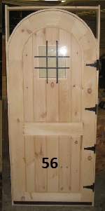 Frame and panel arch top door with iron grill