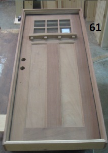 Exterior cherry craftsman style door with decorative shelf