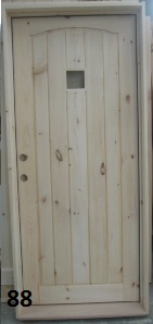 Pine door with arched single panel and small window