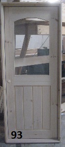 Wood door with arched glass